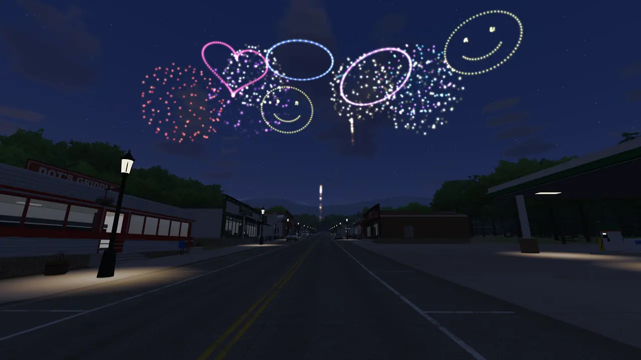 Fourth of July fireworks over Main Street, including heart and smiley-face bursts
